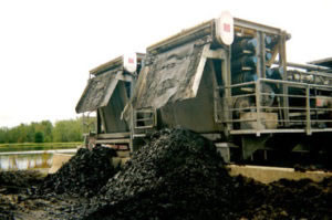 sludge dewatering trucks dumping residuals